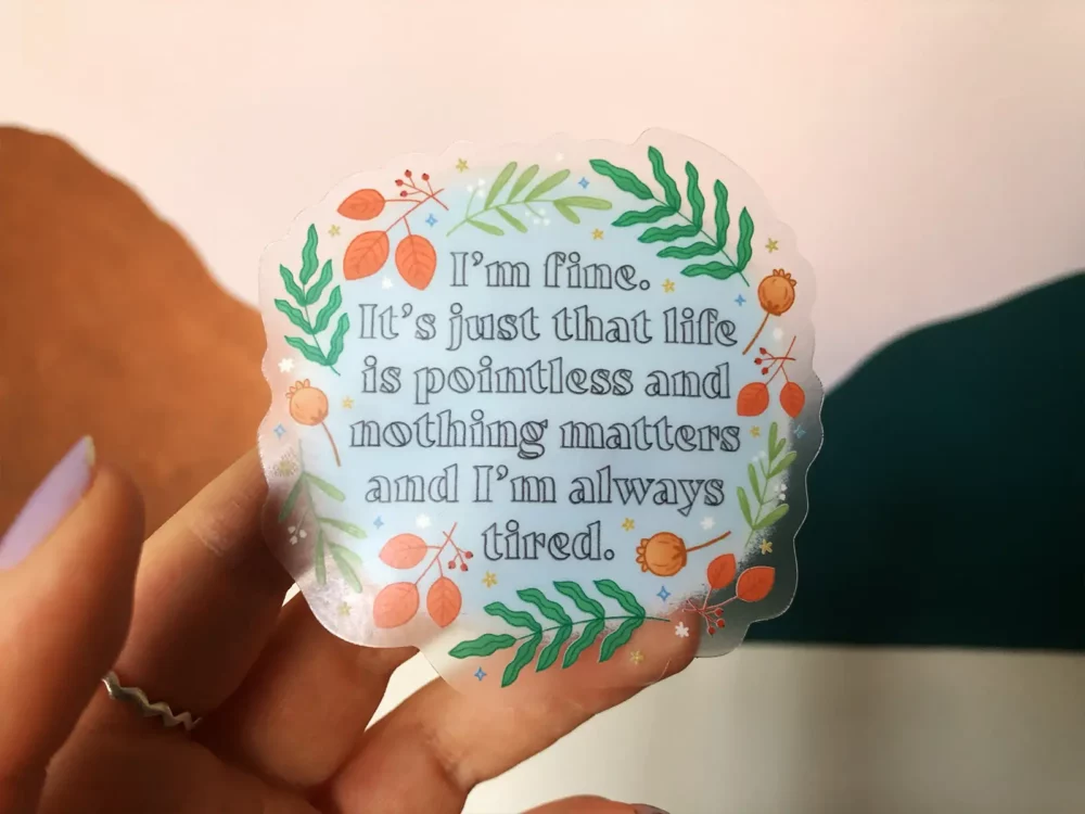Sticker with a quote from Andy Dwyer surrounded with florals, with a transparent base