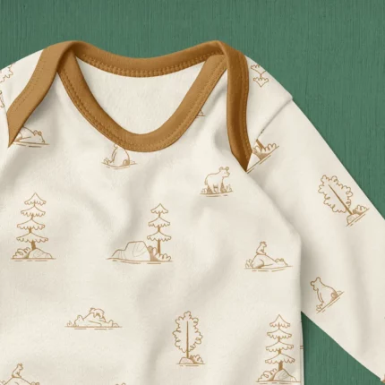 Baby sleeper suit with Bear Hunt pattern.
