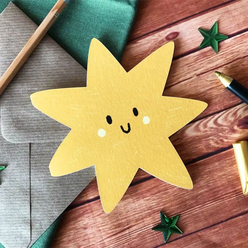 Star shaped greetings card with a smiley face.