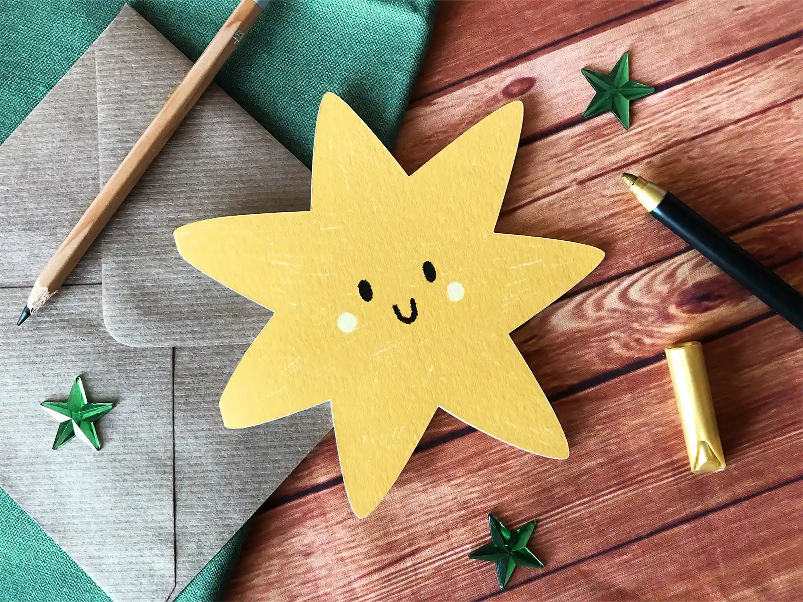 Star shaped greetings card with a smiley face.