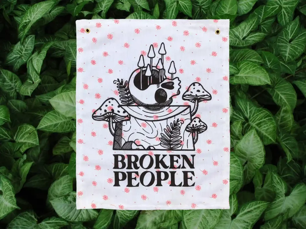 Broken People Banner on floral fabric