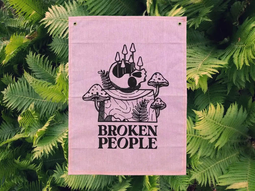 Broken People Banner on pink fabric