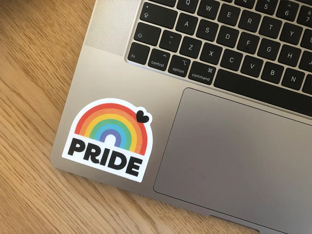 Pride rainbow arch sticker on a laptop