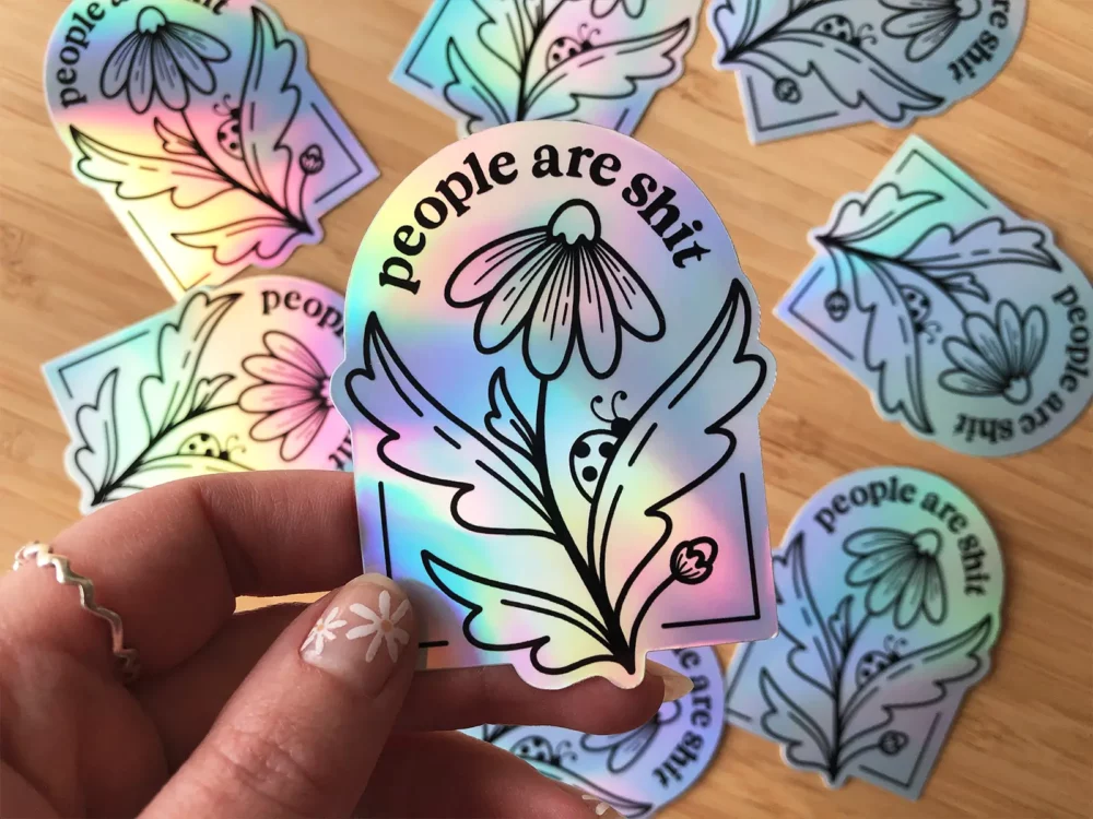 People are shit holographic sticker with a floral design